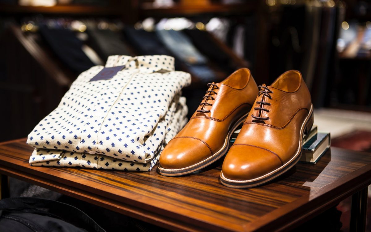 pair of brown leather casual shoes on table