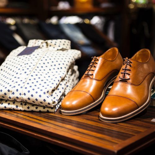 pair of brown leather casual shoes on table